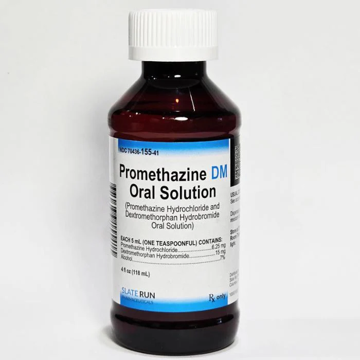 Promethazine DM syrup bottle with measuring cup for cough relief