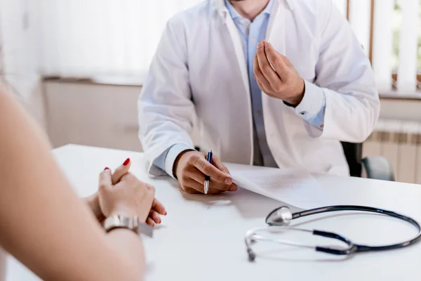 Patient consulting prescription details for drowsiness and codeine side effects prevention