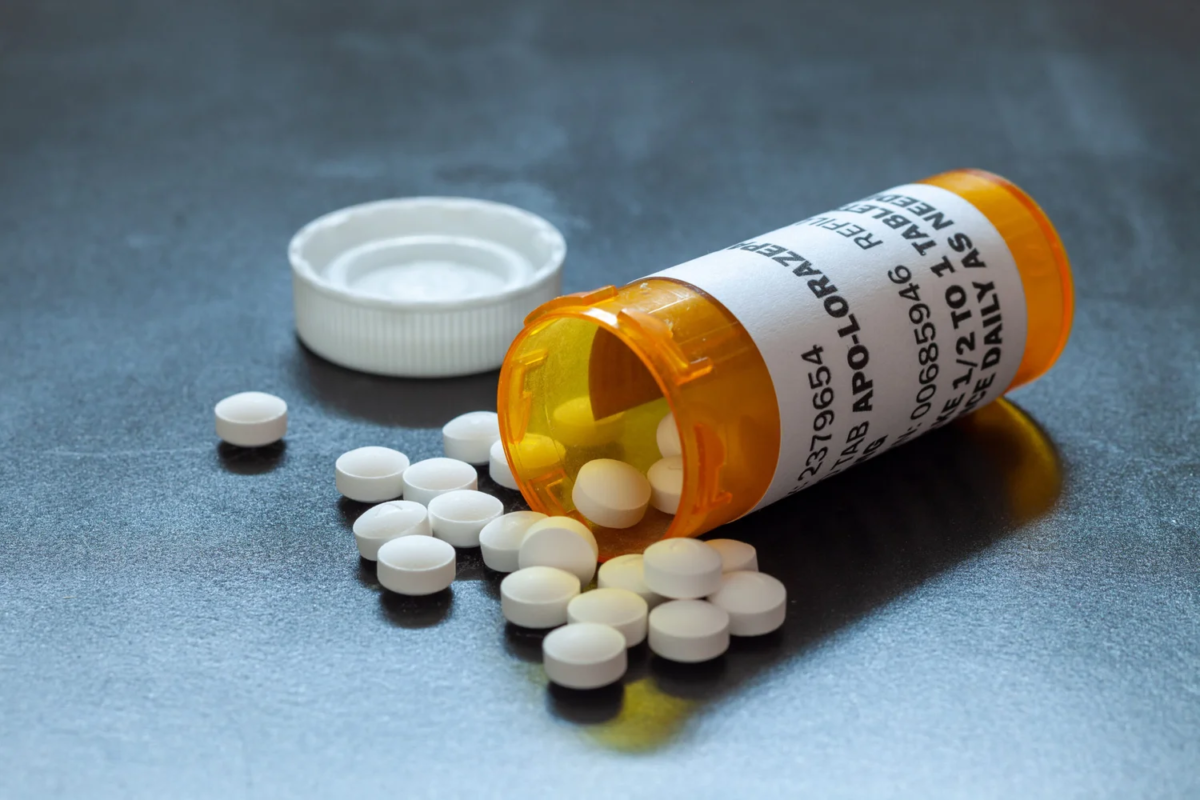 Box of prescription benzodiazepines medication for anxiety relief displayed on a clean pharmacy background.