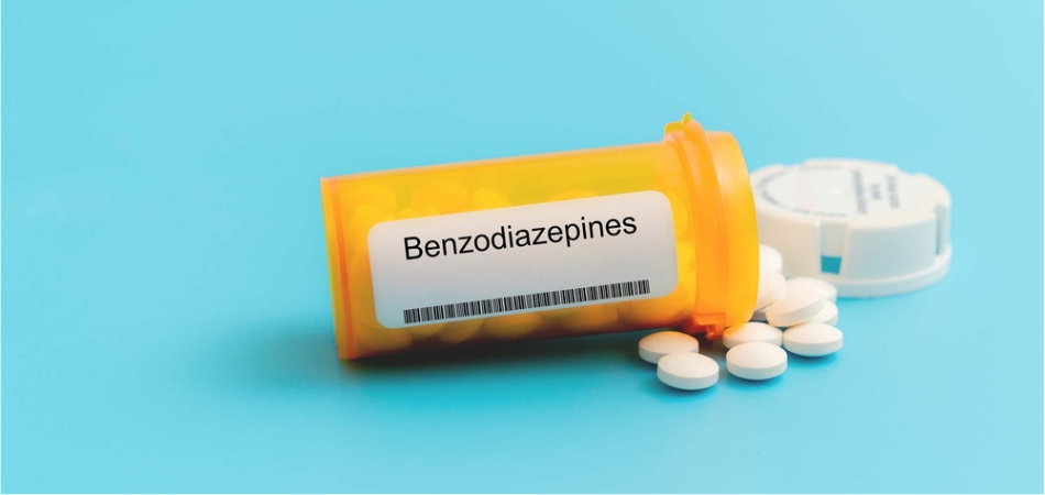 Box of prescription benzodiazepines medication for anxiety relief displayed on a clean pharmacy background.