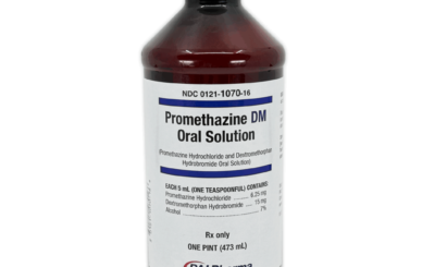 Promethazine DM syrup bottle with measuring cup for accurate oral solution administration