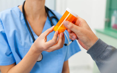 Bottle of decongestant medication labeled with phenylephrine side effects guidelines