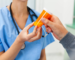 Bottle of decongestant medication labeled with phenylephrine side effects guidelines