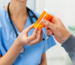 Bottle of decongestant medication labeled with phenylephrine side effects guidelines