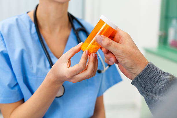Bottle of decongestant medication labeled with phenylephrine side effects guidelines